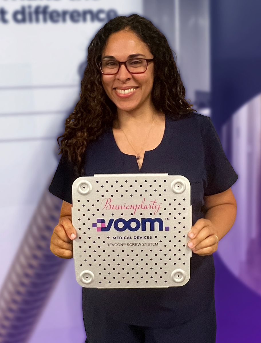 Dr. Joanna Ayoub holds the Voom console: